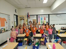 Grade one class wearing their orange shirts.