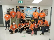 Staff wearing their orange shirts.