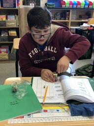 A student experimenting with circuits.