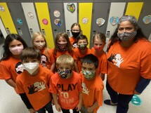 Grade 4 students wearing their orange shirts